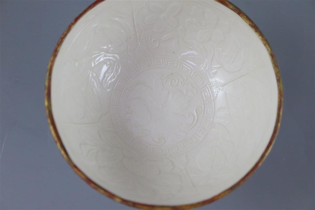 A Chinese Ding ware moulded stem bowl, Song-Jin dynasty or later, 10.4cm diameter